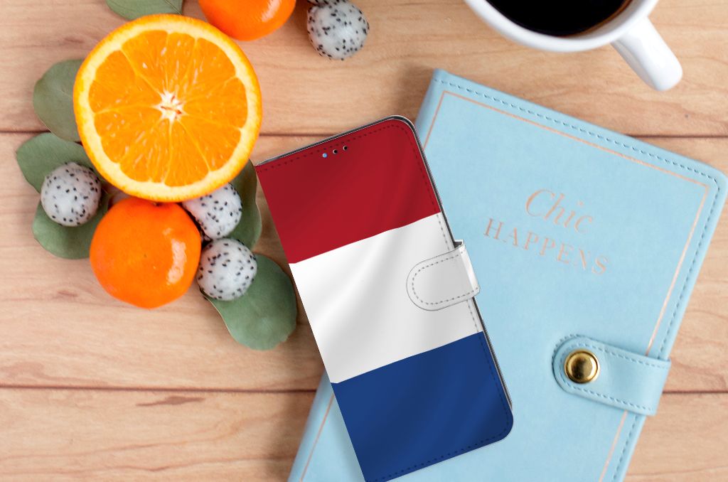 Motorola Moto E20 | E30 | E40 Bookstyle Case Nederlandse Vlag met fruitschalen en notitieboek op tafel
