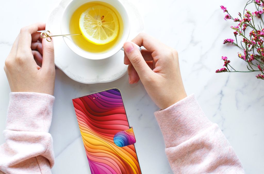 Book Case voor Samsung Galaxy A14 5G Regenboog met kleurrijk ontwerp op een marmeren tafel, vergezeld van thee.