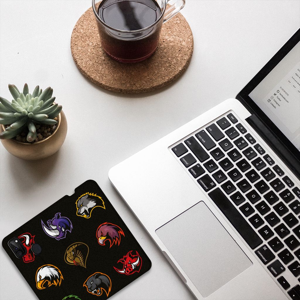 Samsung Galaxy M30s | M21 Magnet Case Cartoon with colorful cartoon designs on a laptop table.