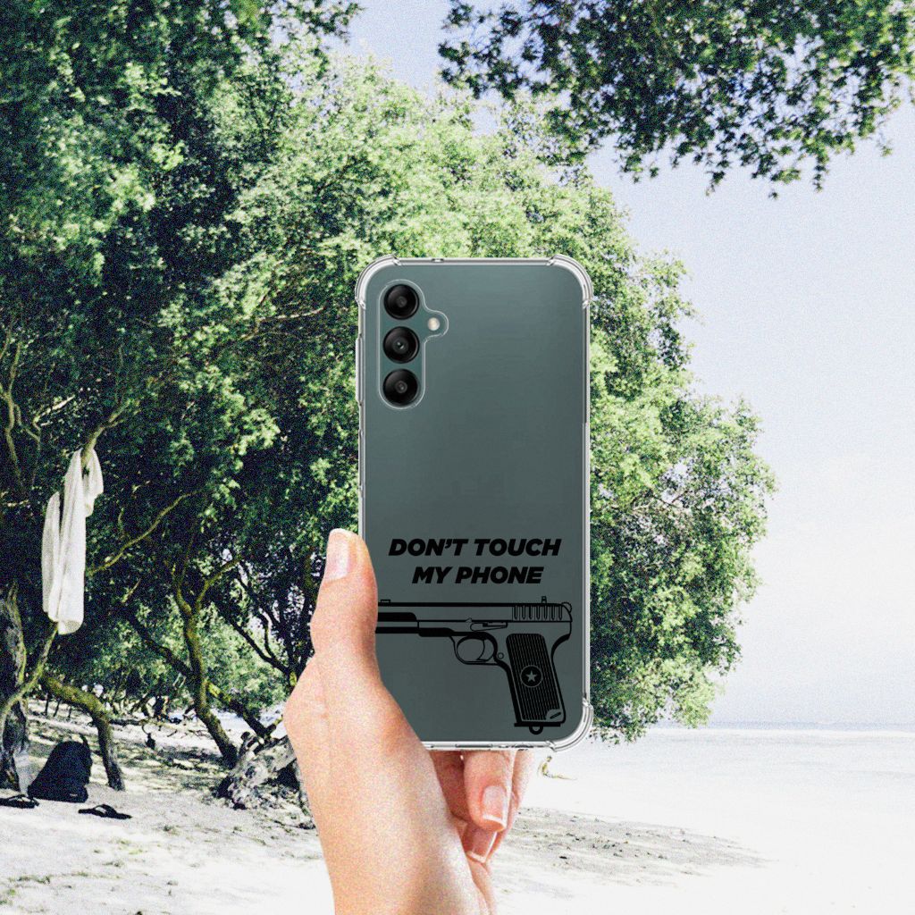 Samsung Galaxy A14 5G/4G Anti Shock Case Pistol DTMP held against a scenic beach backdrop.