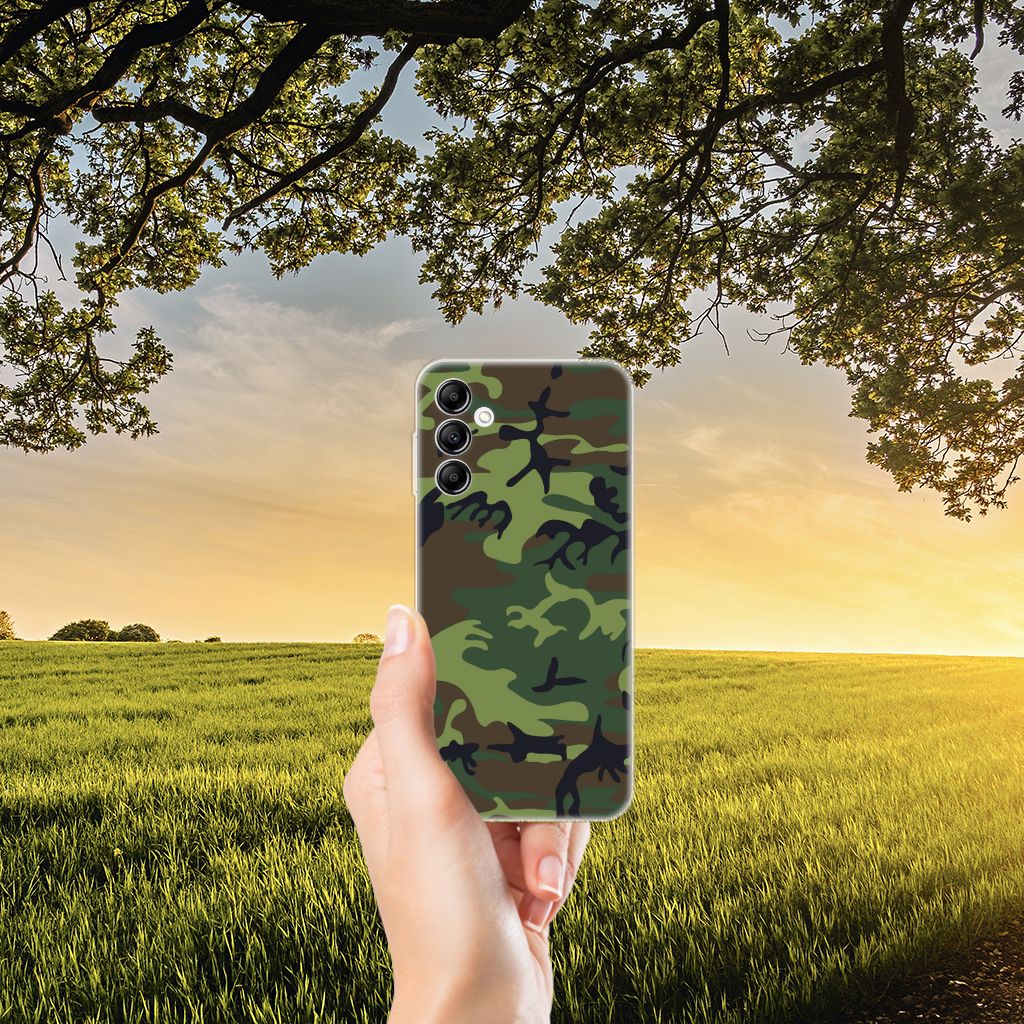 Samsung Galaxy A14 5G TPU bumper Army Dark in hand against a scenic outdoor sunset background.