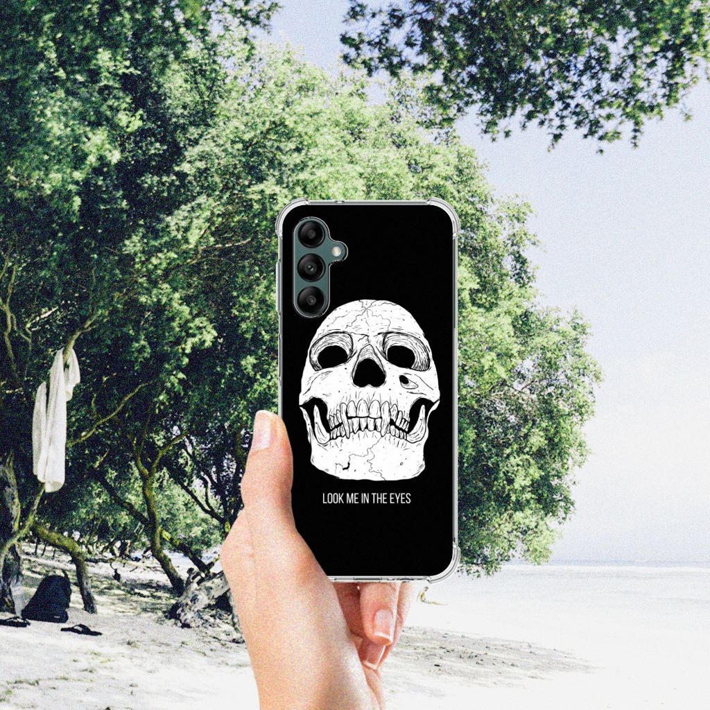 Extreme Case Samsung Galaxy A14 5G/4G Skull Eyes displayed in hand at beach with trees in background.