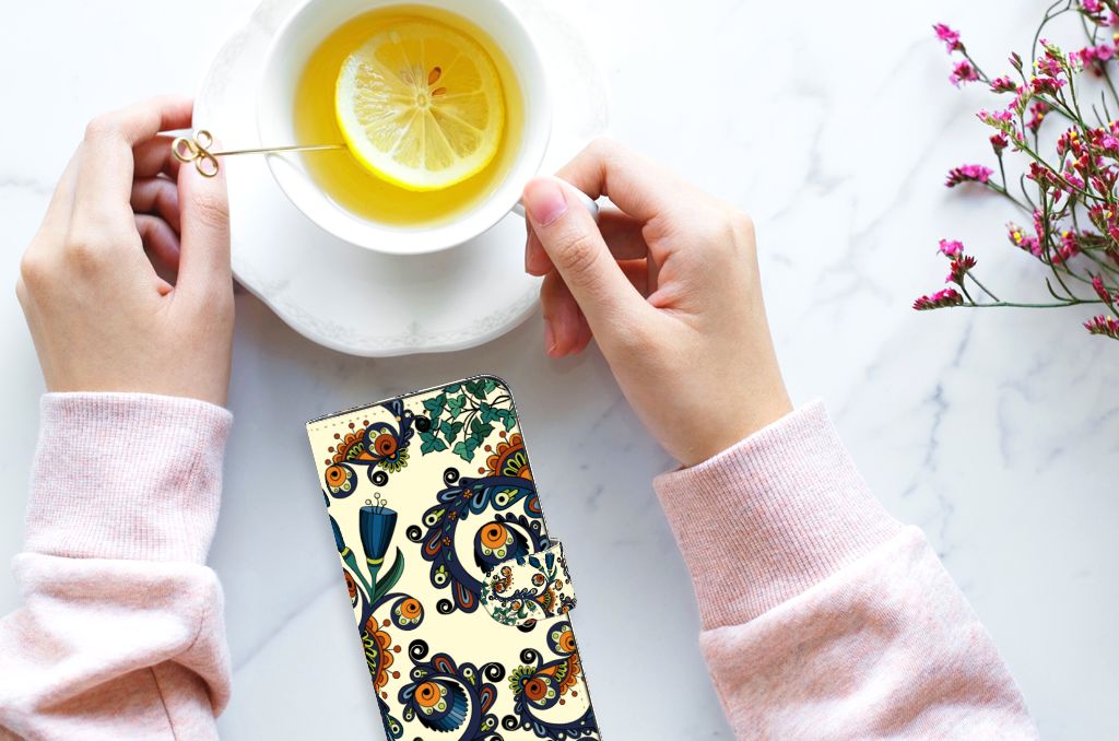 Wallet Case Samsung Galaxy A14 5G Barok Flower in use with tea on a table, showcasing its floral design.