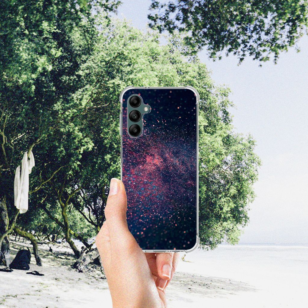 Samsung Galaxy A14 5G/4G Shockproof Case Stars with a cosmic design held in hand by a beach.