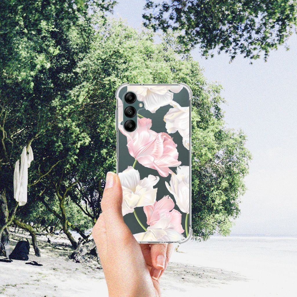 Samsung Galaxy A14 5G/4G Case Lovely Flowers held in a hand with a beach background and greenery.