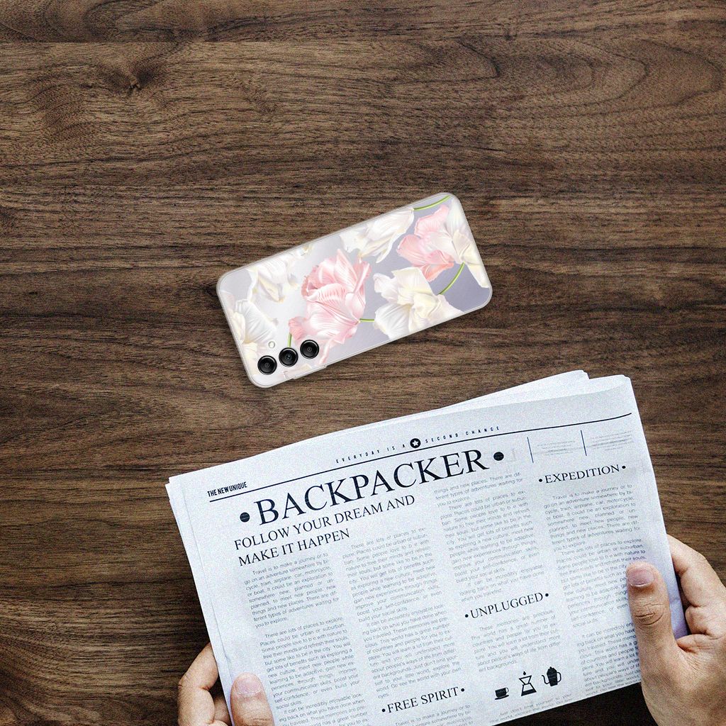 Samsung Galaxy A14 5G TPU Case Lovely Flowers on a wooden table next to a newspaper.