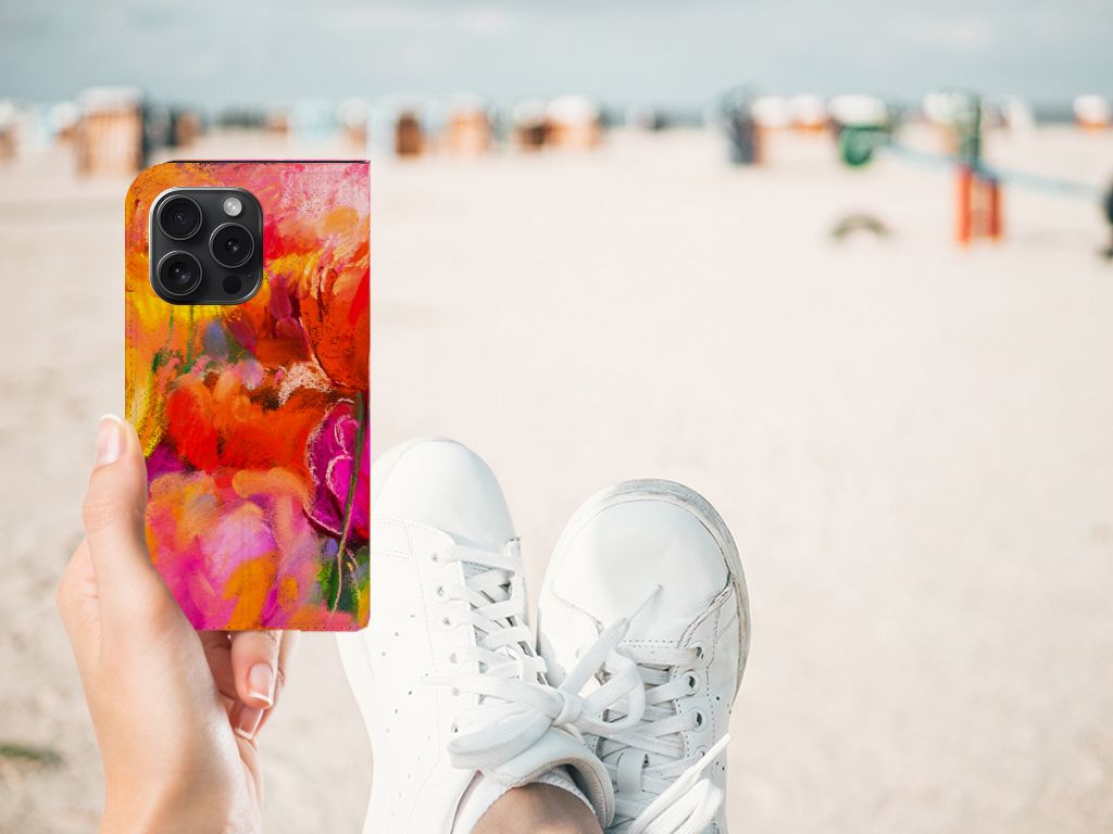 Bookcase iPhone 15 Pro Tulips in hand with vibrant floral design at the beach