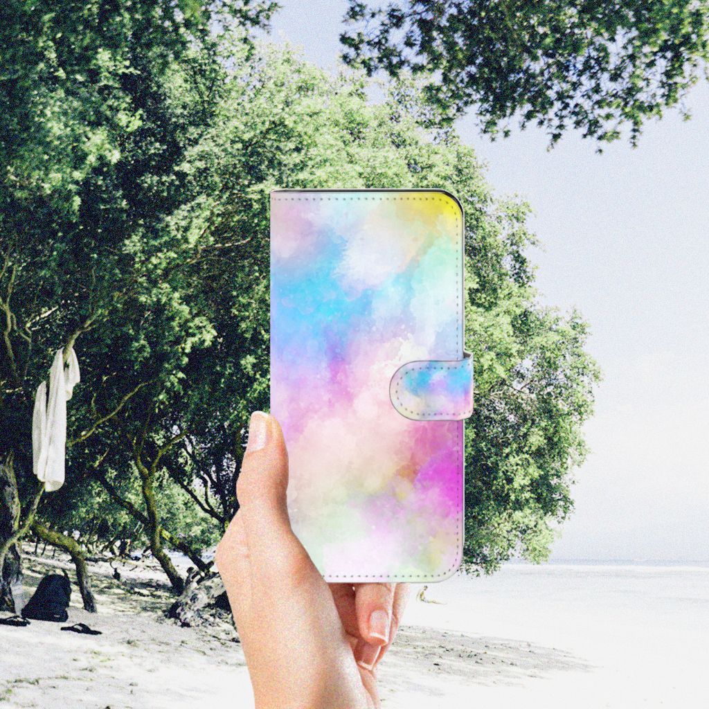 Hoesje Motorola Moto G53 Watercolor Light in pastel colors being held outdoors by a beach.