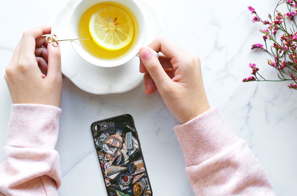 iPhone SE 2022 | SE 2020 | 7/8 Silicone Back Case Badges on a table with a cup of tea and lemon.