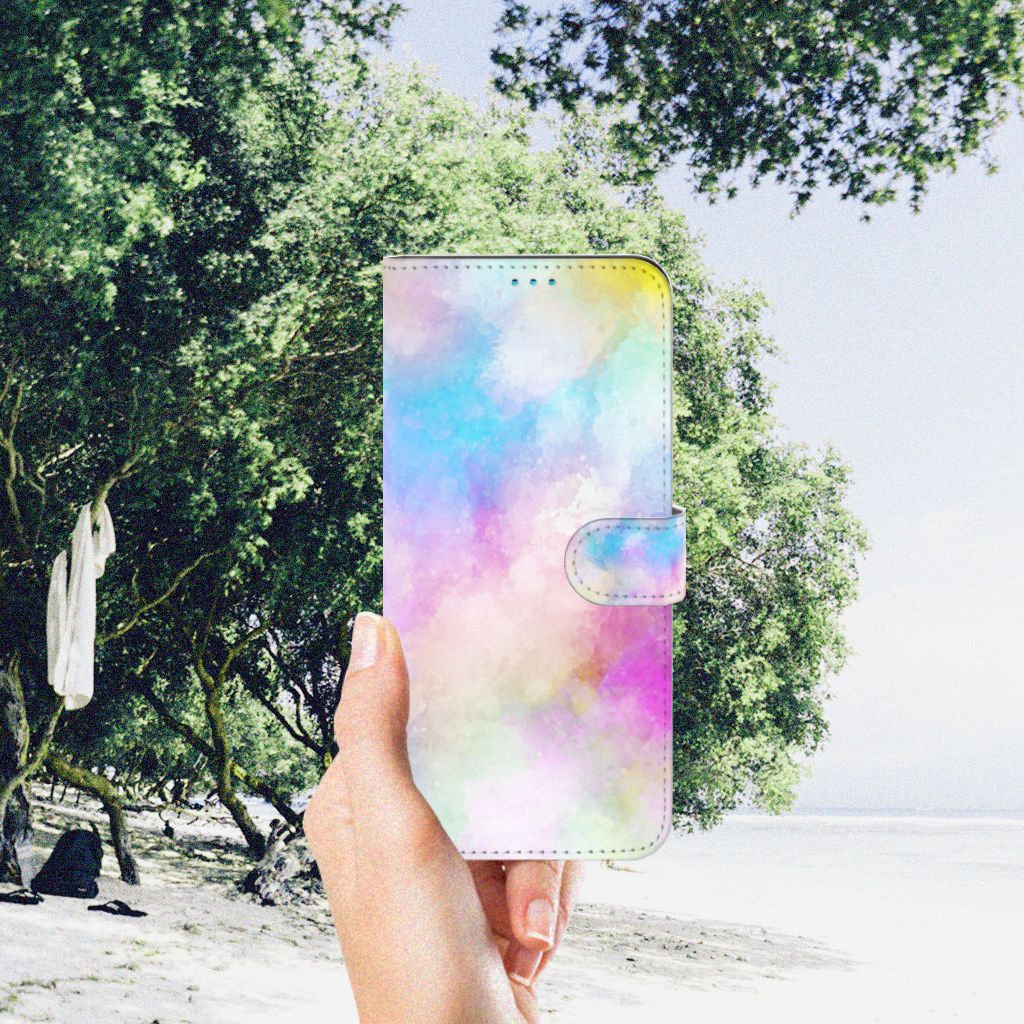 Hoesje Motorola Moto G51 5G Watercolor Light in pastel colors, held against a beach background.