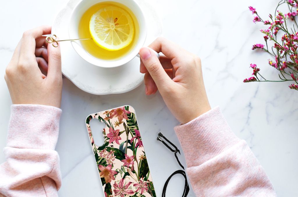 Samsung Galaxy A14 5G Case Flowers design displayed with a cup of lemon tea on a marble surface.
