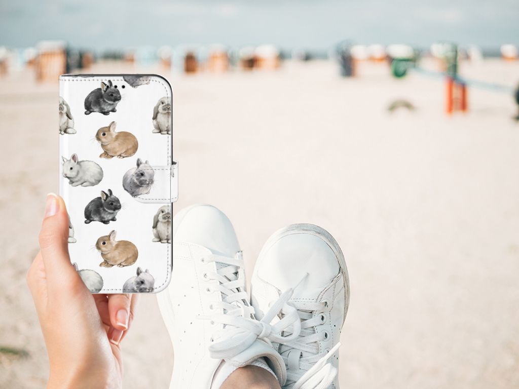 Telefoonhoesje met Pasjes voor Apple iPhone 11 Konijntjes met schattige konijnen dessin op een strand.