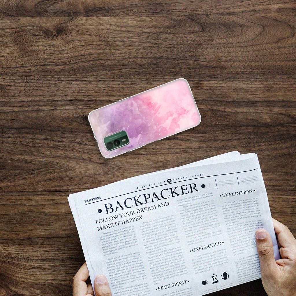 Hoesje maken Nokia XR21 Pink Purple Paint op een tafel met een krant, stijlvol en beschermend design.