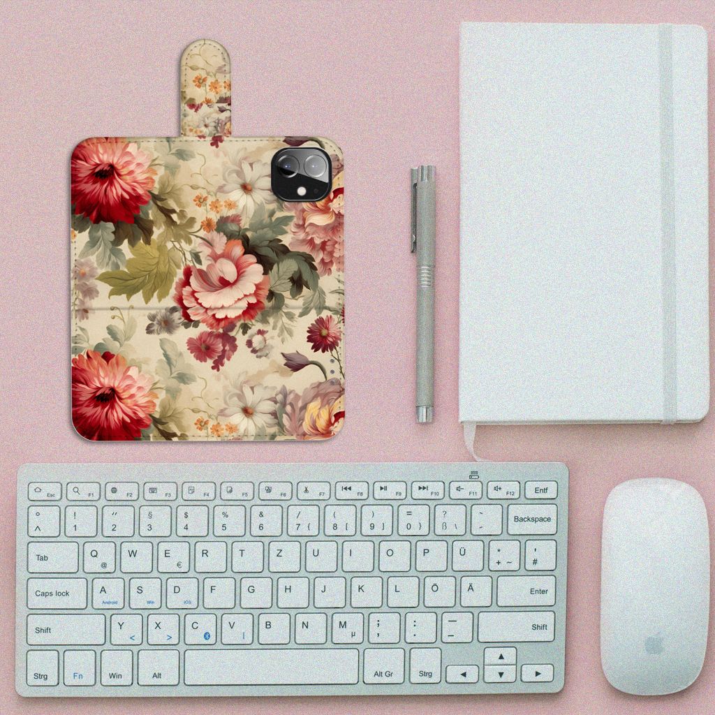 Hoesje voor Apple iPhone 12 Mini Bloemen met kleurrijk bloemendesign op een bureau met toetsenbord en notitieboek.