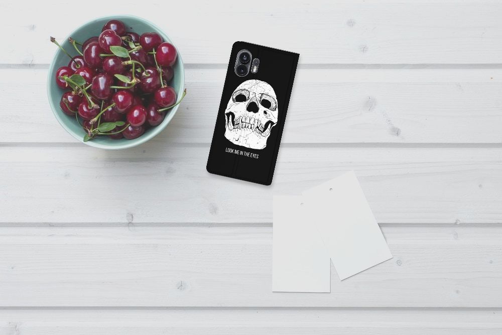 Mobiel BookCase Nothing Phone (2) Skull Eyes bovenaanzicht ontwerp met skull op zwarte achtergrond