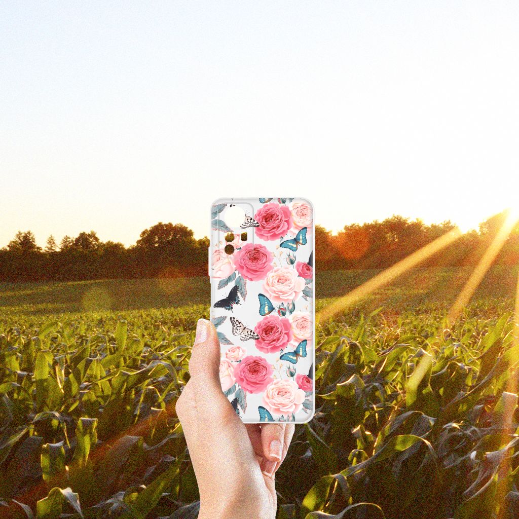Xiaomi Redmi Note 12S TPU Case Butterfly Roses in hand with a sunny field background, combining stijl en bescherming.