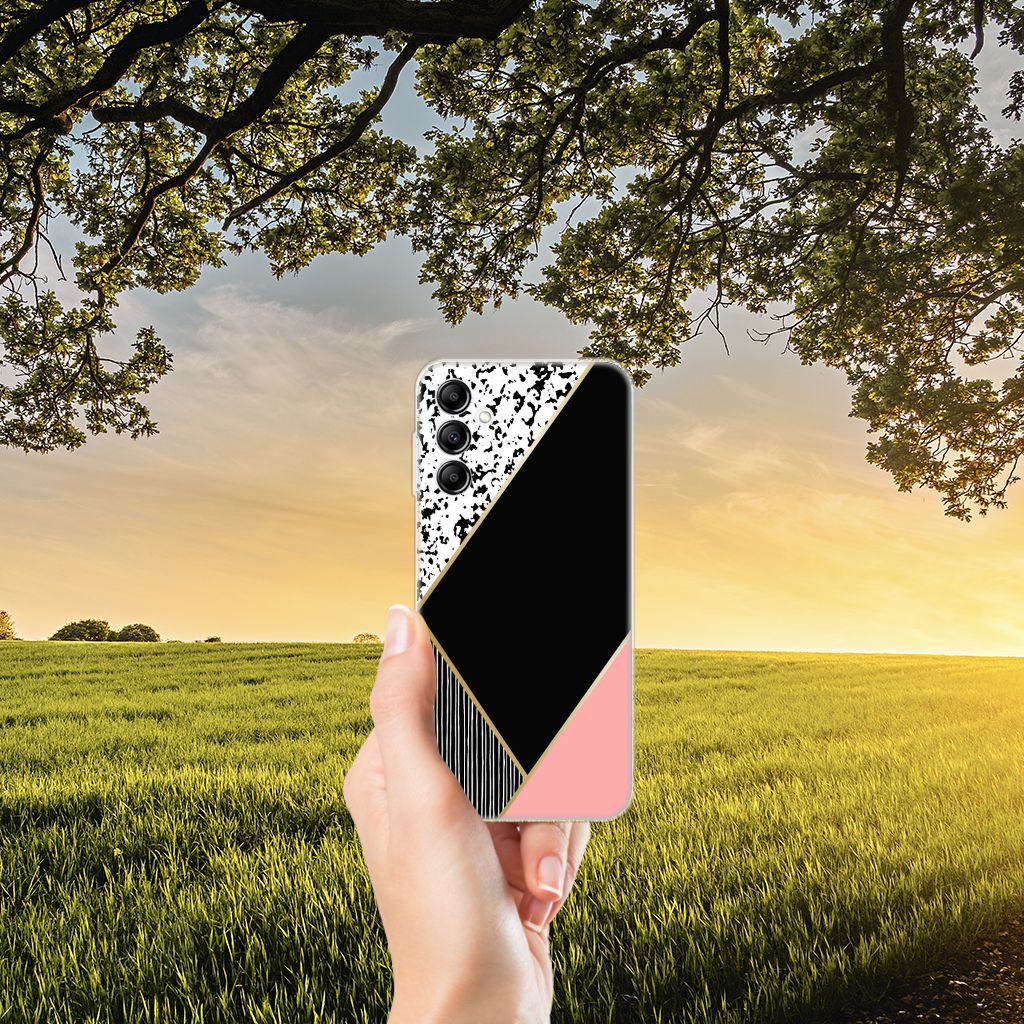 Samsung Galaxy A14 5G TPU Hoesje Zwart Roze Vormen in hand met natuurachtergrond.