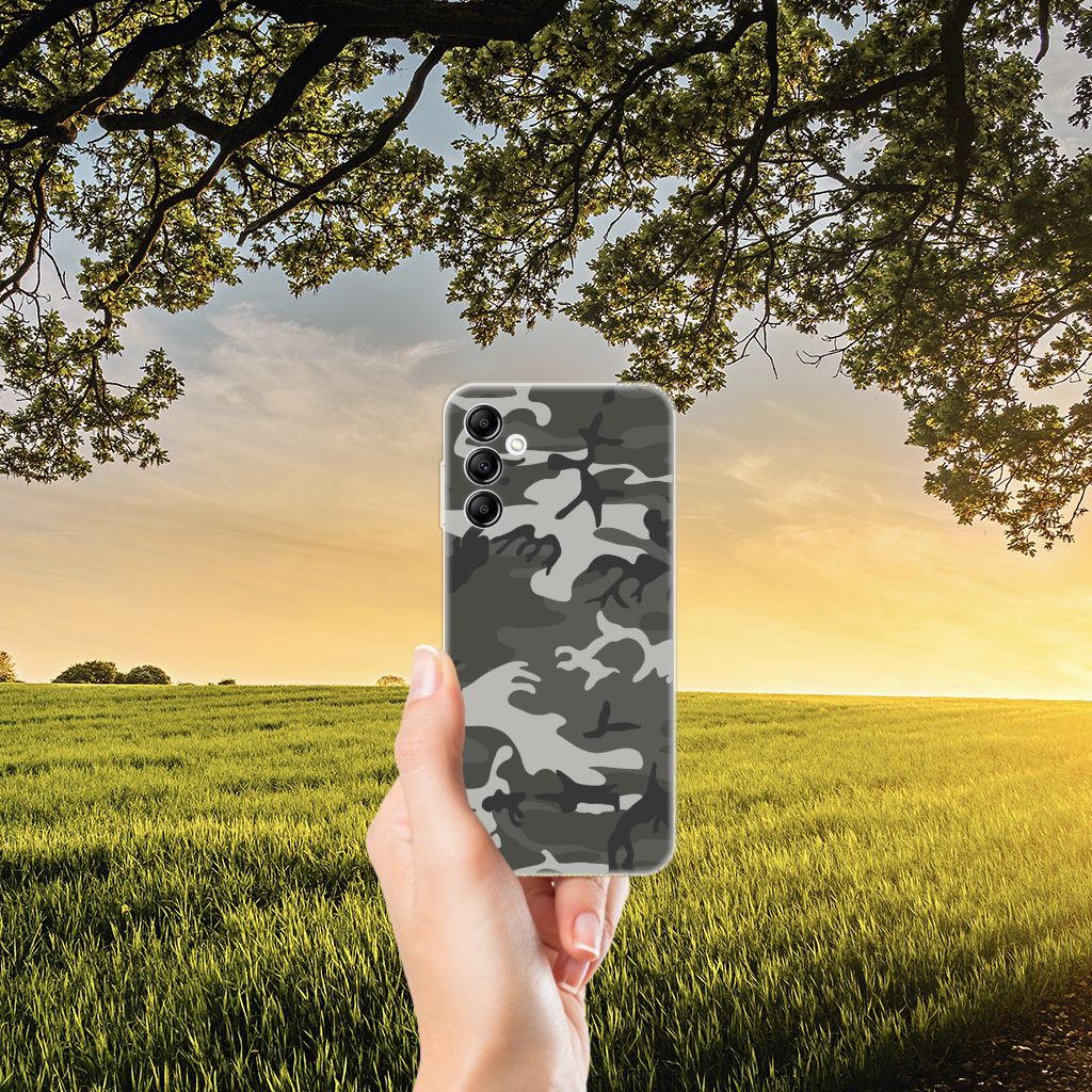 Samsung Galaxy A14 5G TPU bumper Army Light in hand, set against a natural landscape with sunset.