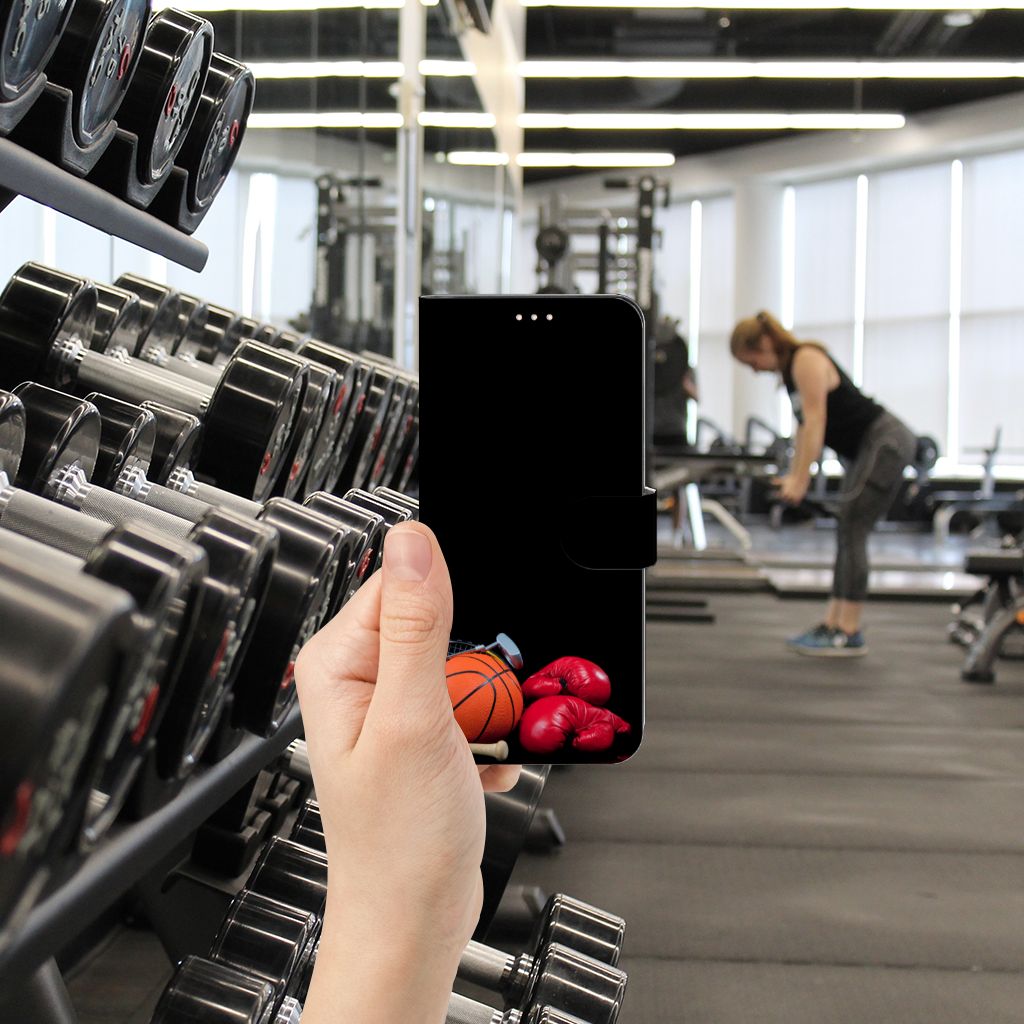 Xiaomi Redmi Note 10/10T 5G | Poco M3 Pro Wallet Case met Pasjes Sports displayed in a gym setting with weights and a person exercising.