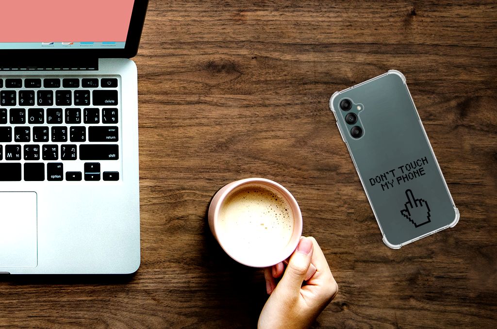 Samsung Galaxy A14 5G/4G Anti Shock Case Finger Don't Touch My Phone on a wooden table with laptop and coffee.