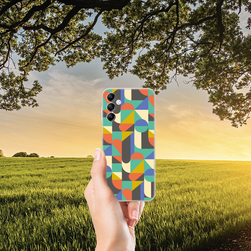 Samsung Galaxy A14 5G TPU bumper Funky Retro case held against a sunset backdrop with vibrant geometric patterns.