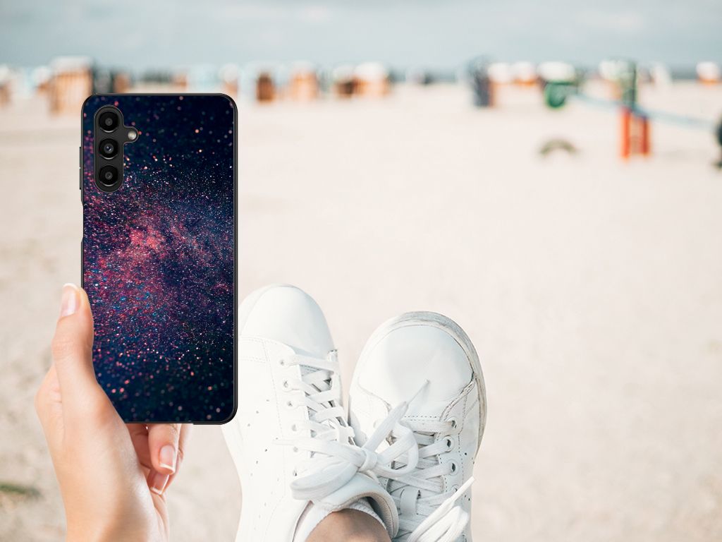 Samsung Galaxy A14 5G Backcover Stars in abstract galaxy design held outdoors on the beach.