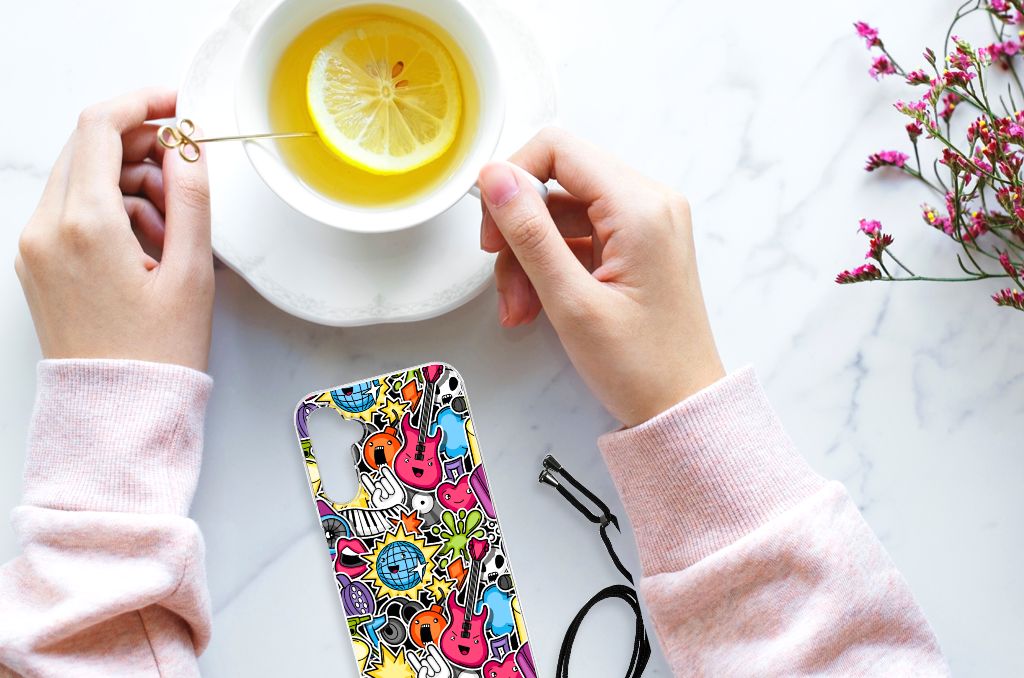 Samsung Galaxy A14 5G Anti Shock Bumper Case Punk Rock design with colorful graphics next to a cup of tea.
