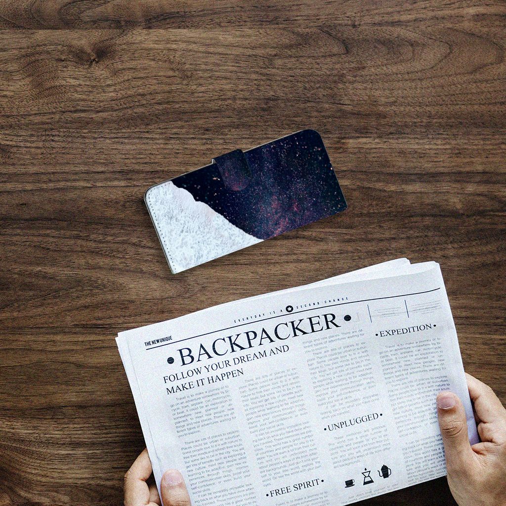 Samsung Galaxy A14 4G Book Case Sea in Space on a wooden table with a newspaper.