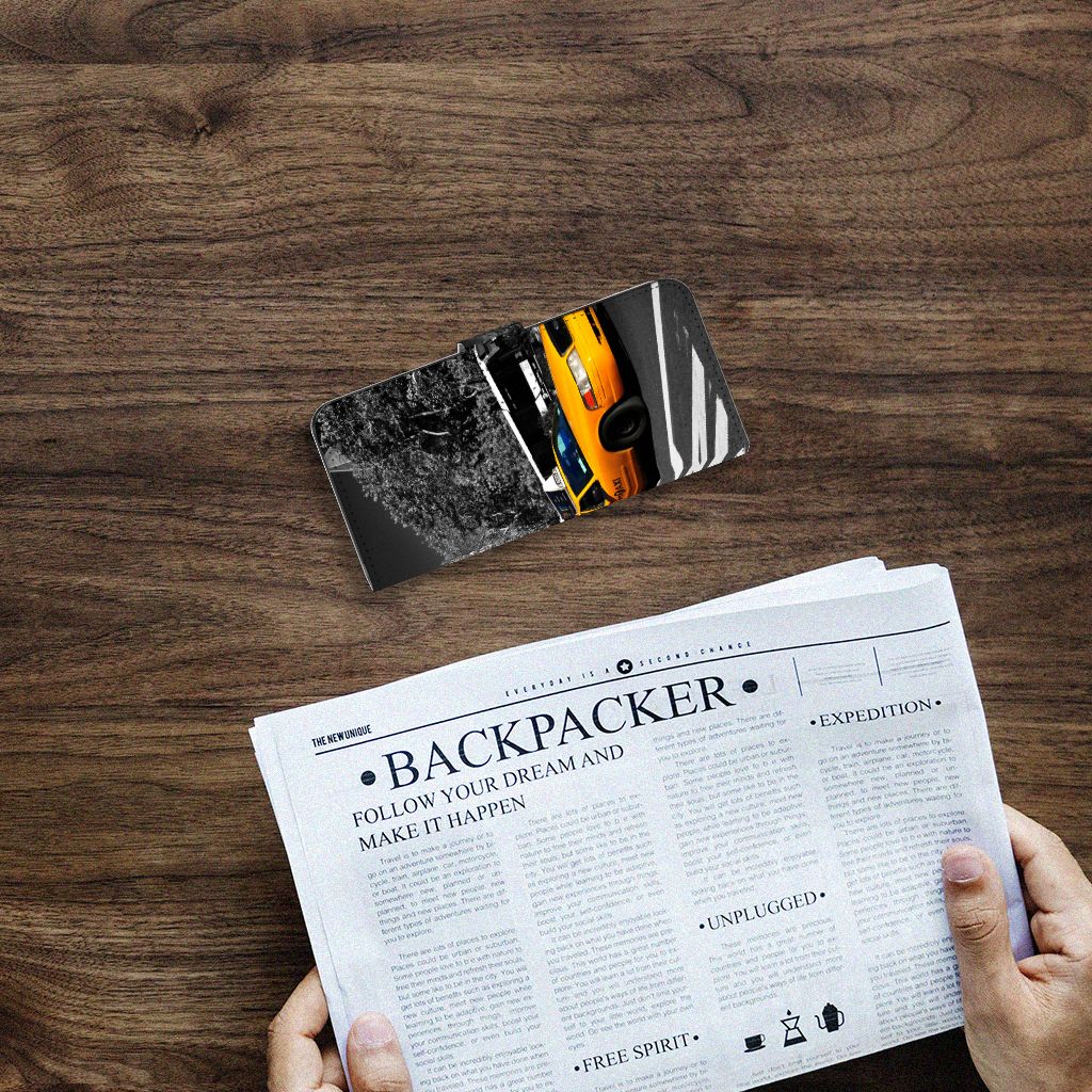 Samsung Galaxy A14 4G Flip Cover New York Taxi on a wooden table with newspaper.