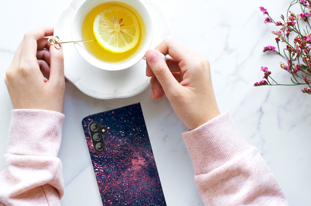 Samsung Galaxy A14 4G Stand Case Stars design with colorful glitter on a marble table with a cup of tea.