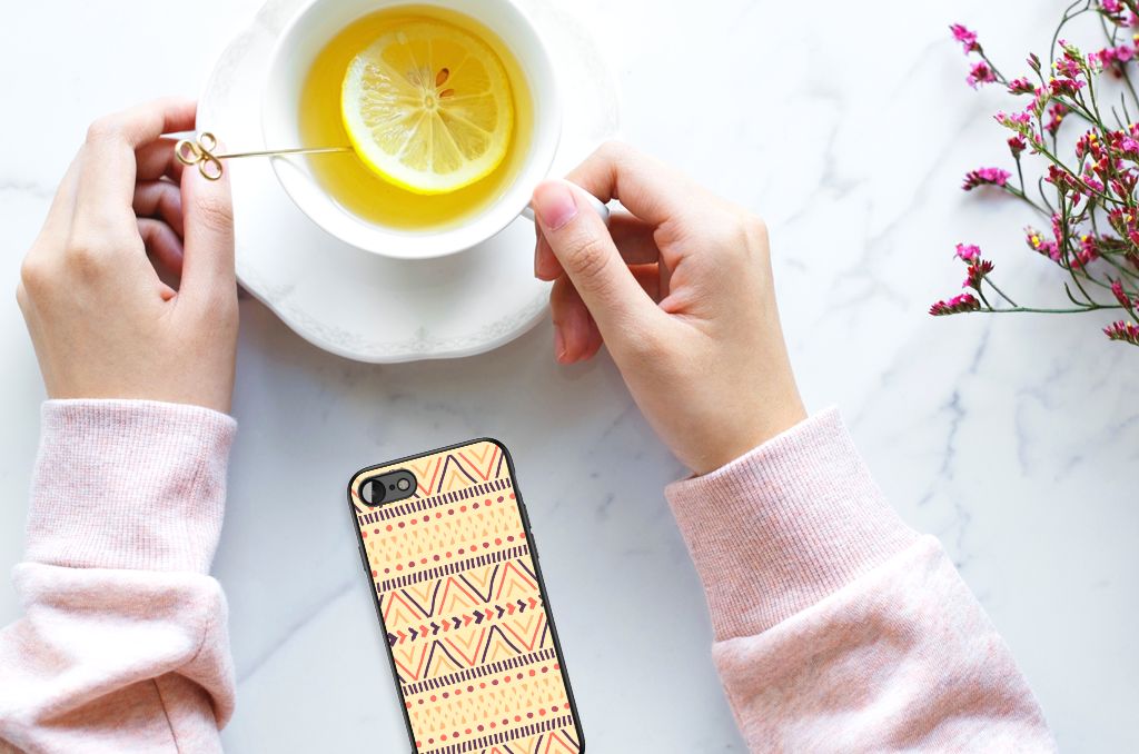 iPhone SE 2022 | SE 2020 | 7/8 Back Case Aztec Yellow next to a cup of tea with lemon on a marble table.