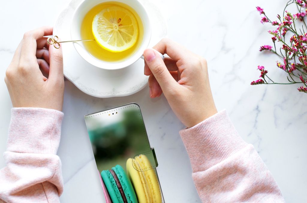 Samsung Galaxy A14 5G Book Cover Macarons with vibrant macarons design and a cup of lemon tea.