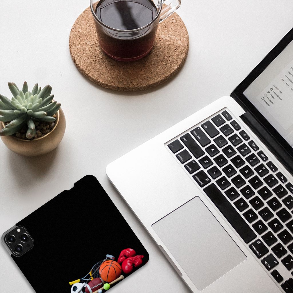 iPhone 13 Pro Max Hippe Standcase Sports with various sports equipment design next to a laptop and coffee.
