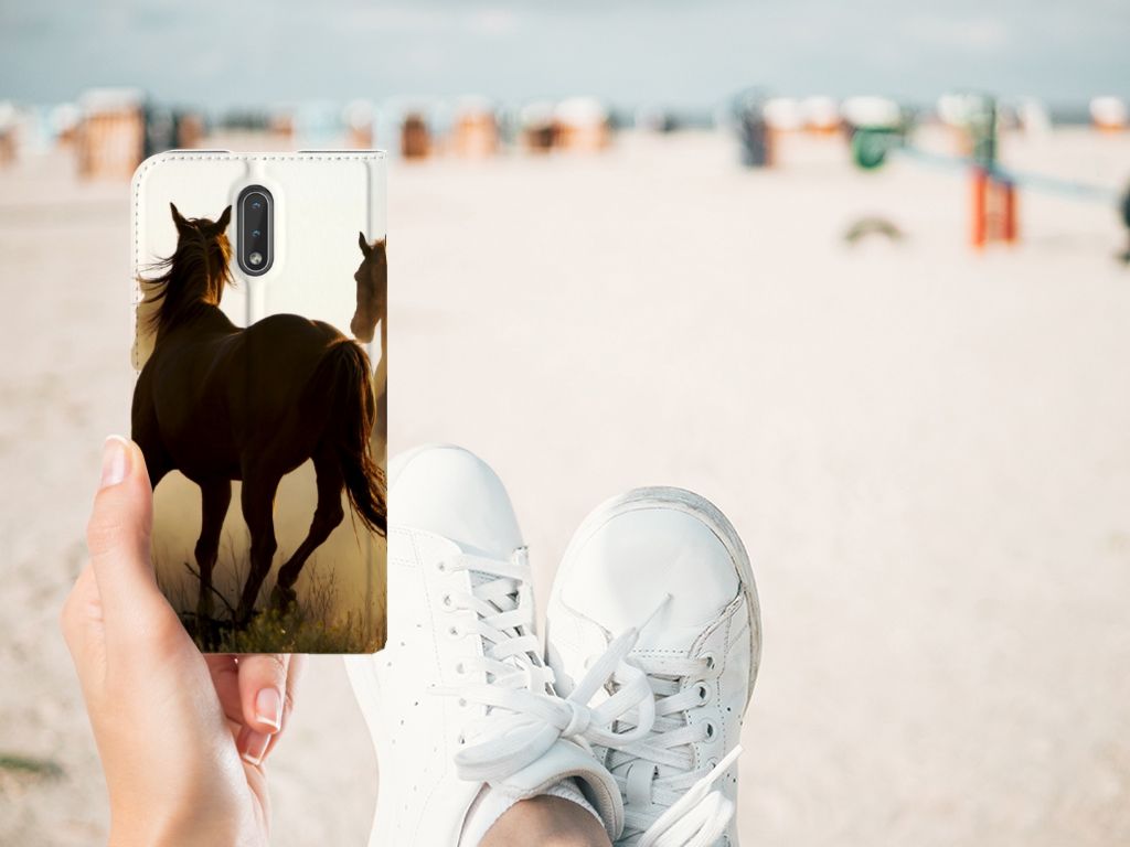 Nokia 2.3 Hoesje maken Design Cowboy met paardenprint op een smartphonecasus op het strand.