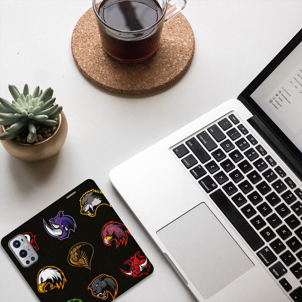 OnePlus 9 Pro Magnet Case Cartoon on a desktop with a laptop and coffee cup.