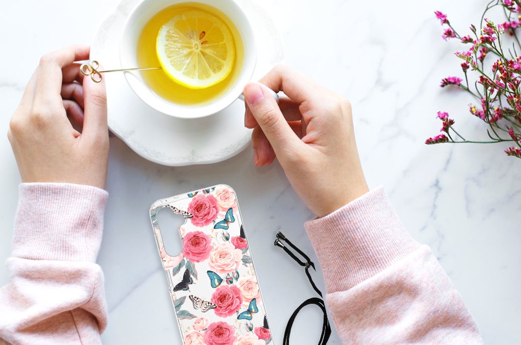 Samsung Galaxy A14 5G Case Butterfly Roses design displayed with a cup of tea and lemon on a marble tabletop.