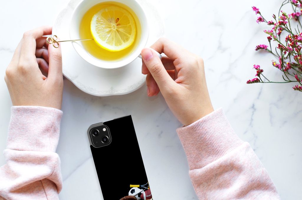 iPhone 13 Mini Hippe Standcase Sports on a table with tea and a lemon slice.
