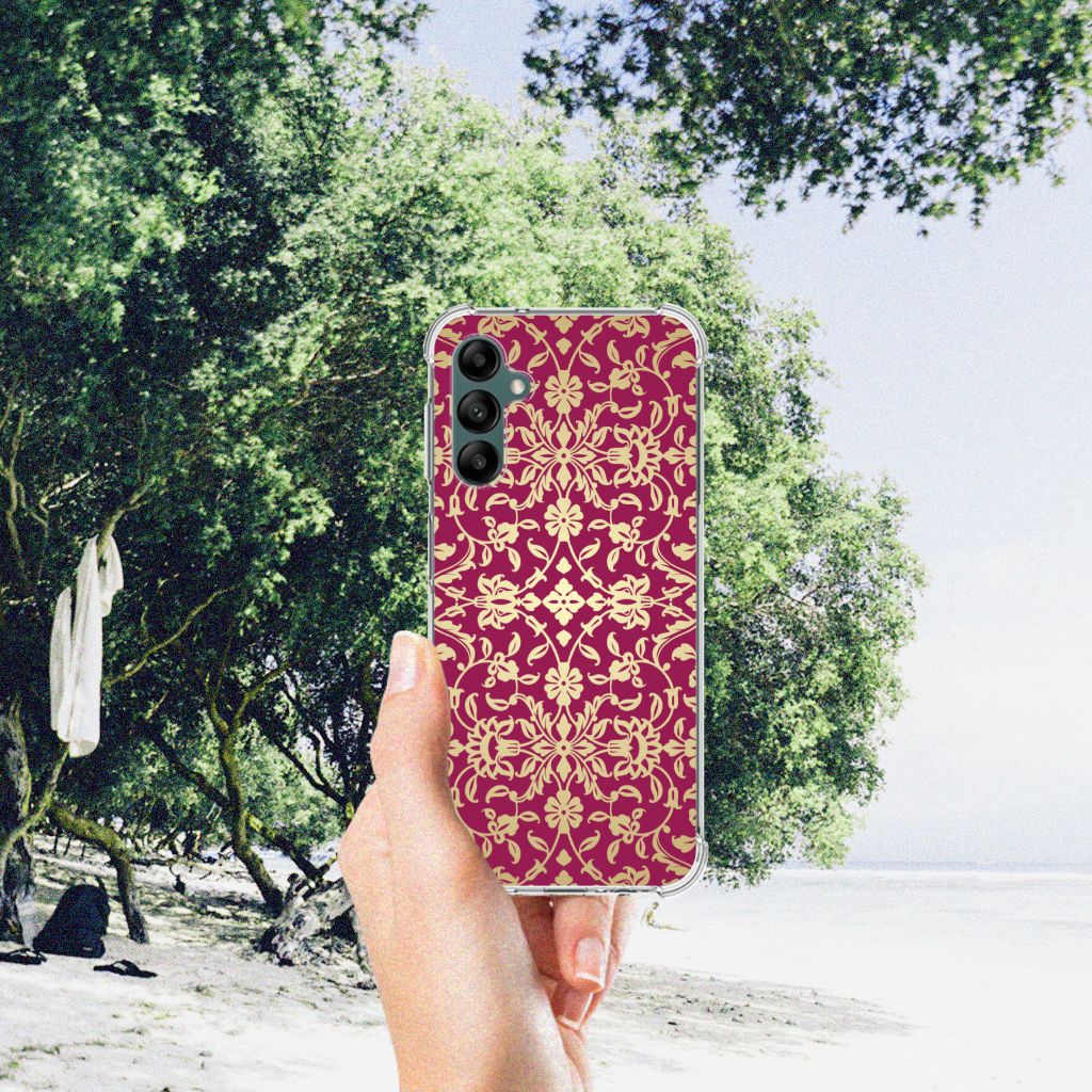 Anti Shock Case Samsung Galaxy A14 5G/4G Barok Pink displayed in hand on a beach with greenery.