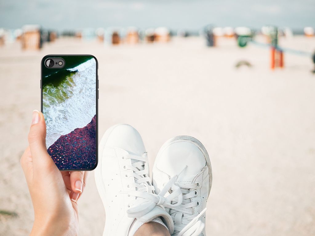 iPhone SE 2022 | SE 2020 | 7/8 Backcover Sea in Space held by a person at the beach with white sneakers.