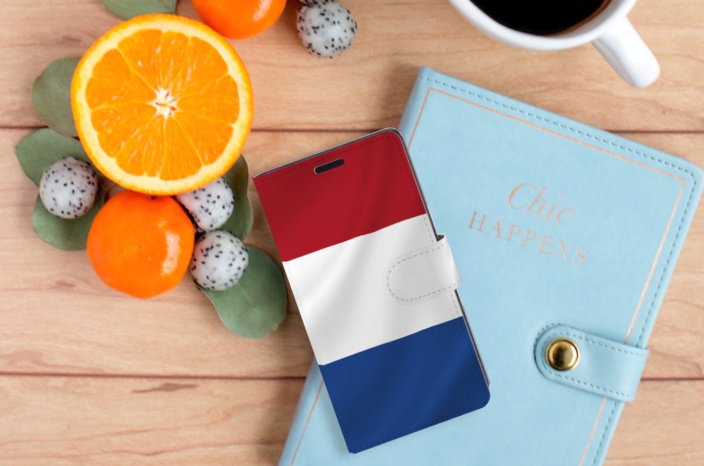 Sony Xperia XZ | Sony Xperia XZs Bookstyle Case Nederlandse Vlag met fruit en een notitieboekje op houten tafel.