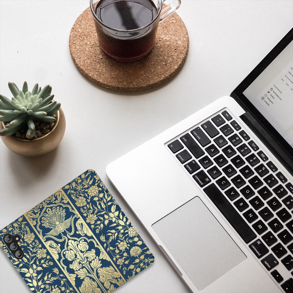 Samsung Galaxy A14 5G Smart Cover Beige Flowers on a desk next to a laptop and coffee, with a succulent plant.