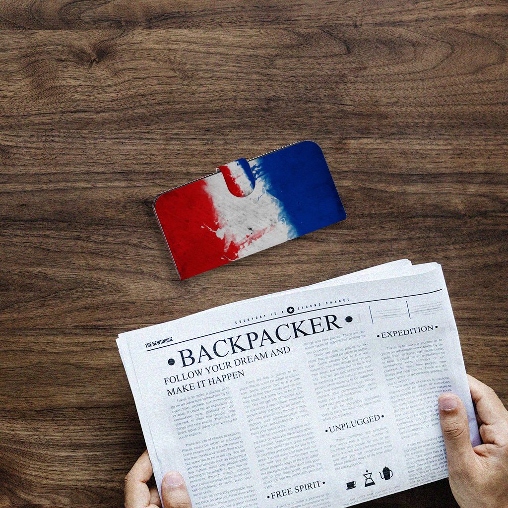 Samsung Galaxy S24 Plus Bookstyle Case Nederland met design van de Nederlandse vlag op een houten tafel.