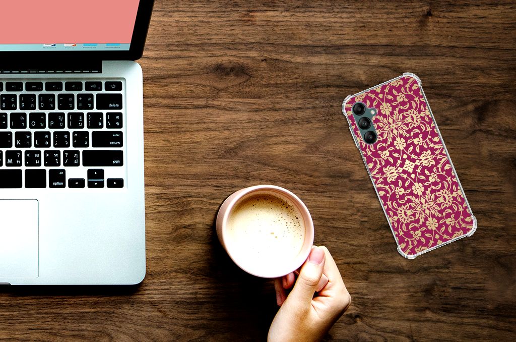 Anti Shock Case Samsung Galaxy A14 5G/4G Barok Pink displayed next to a laptop and coffee on a wooden table.