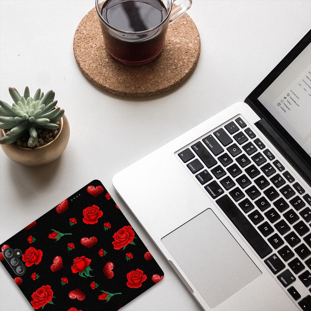Samsung Galaxy A14 5G Magnet Case Valentine design with red roses on a black background next to a laptop and a coffee.