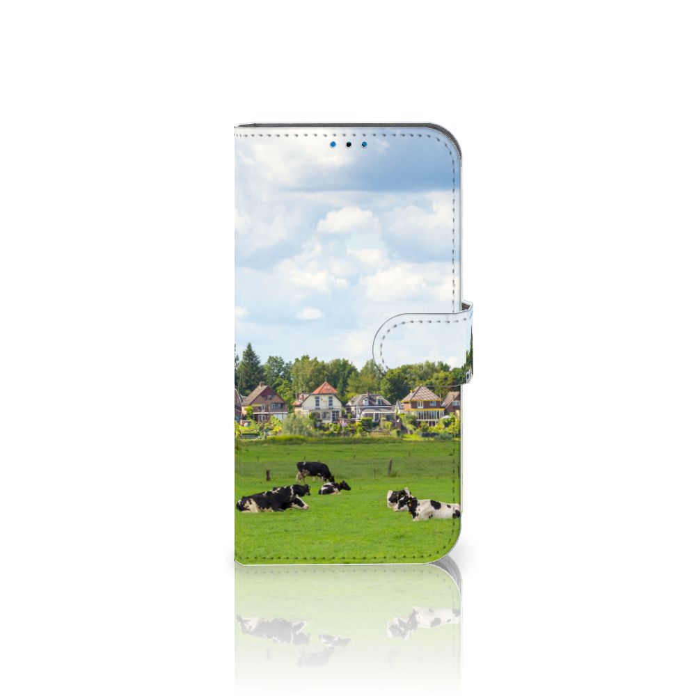iPhone 14 Pro Telefoonhoesje met Pasjes Koeien met grazende koeien op een groene achtergrond.