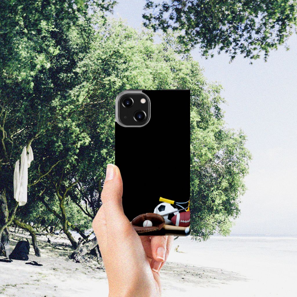 iPhone 14 Hippe Standcase Sports with various sports designs held in hand on a beach scene