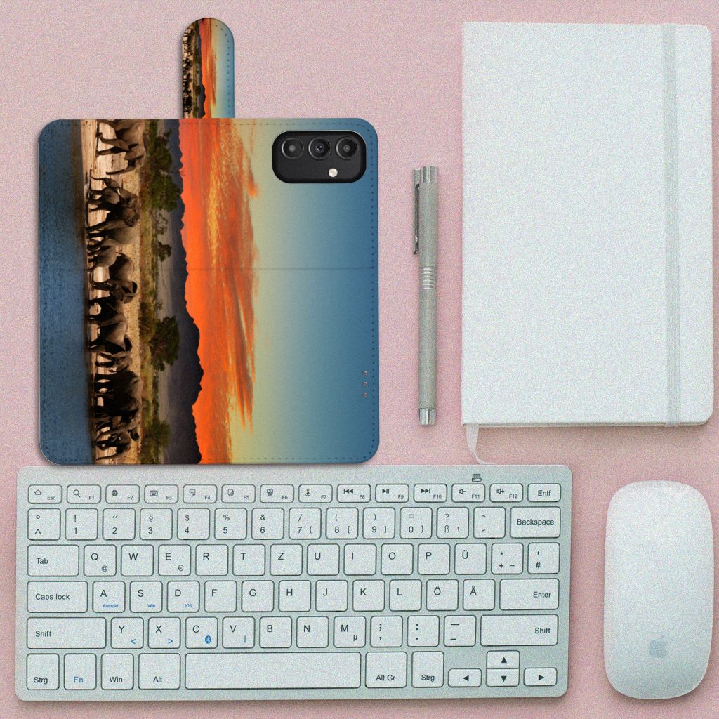 Samsung Galaxy A14 5G Telefoonhoesje met Pasjes Olifanten met olifanten onder een rode lucht