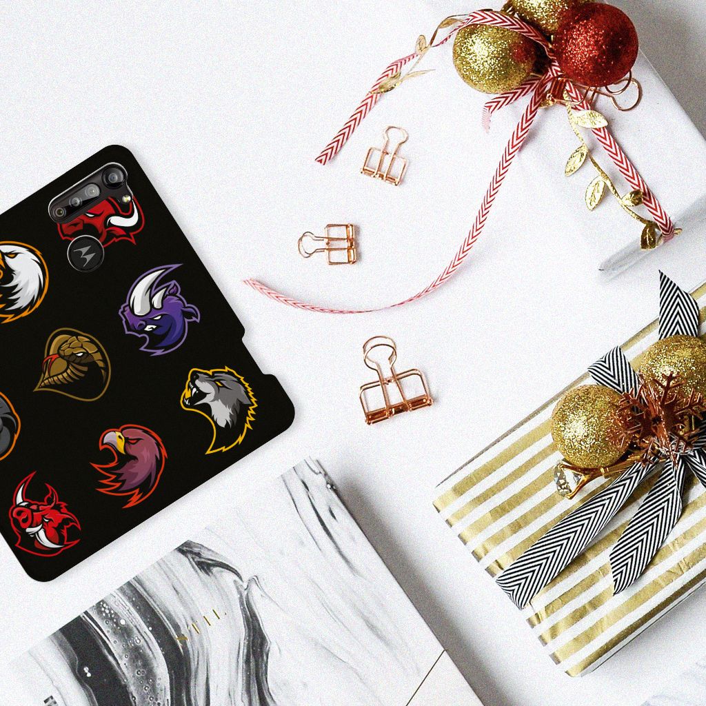 Motorola Moto G8 Power Magnet Case Cartoon with colorful animal designs on a desk surrounded by holiday decorations.