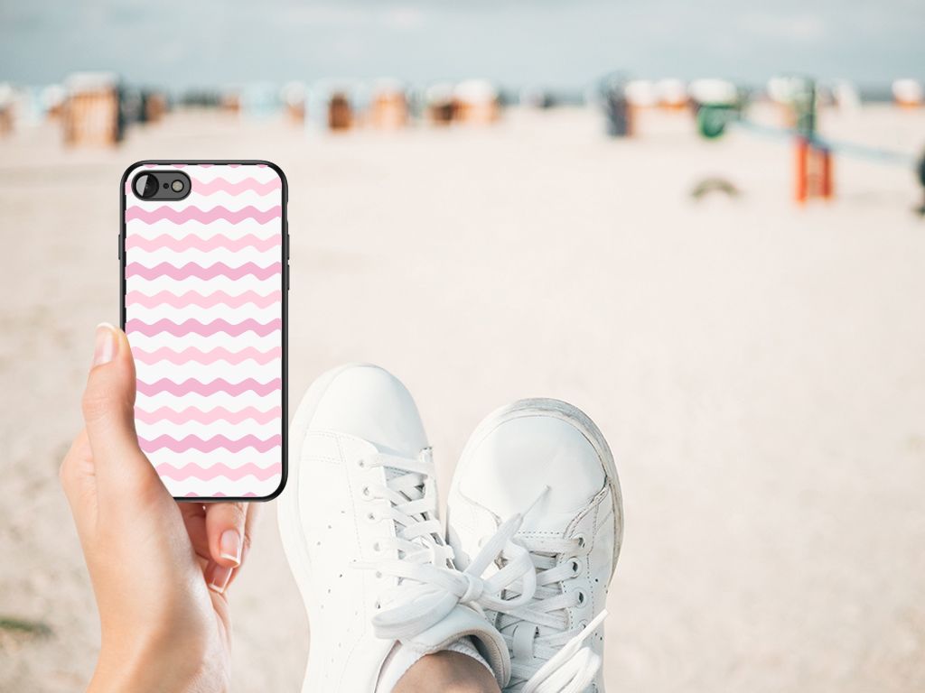 iPhone SE 2022 | SE 2020 | 7/8 Back Case Waves Roze in hand, showcased on a beach setting.