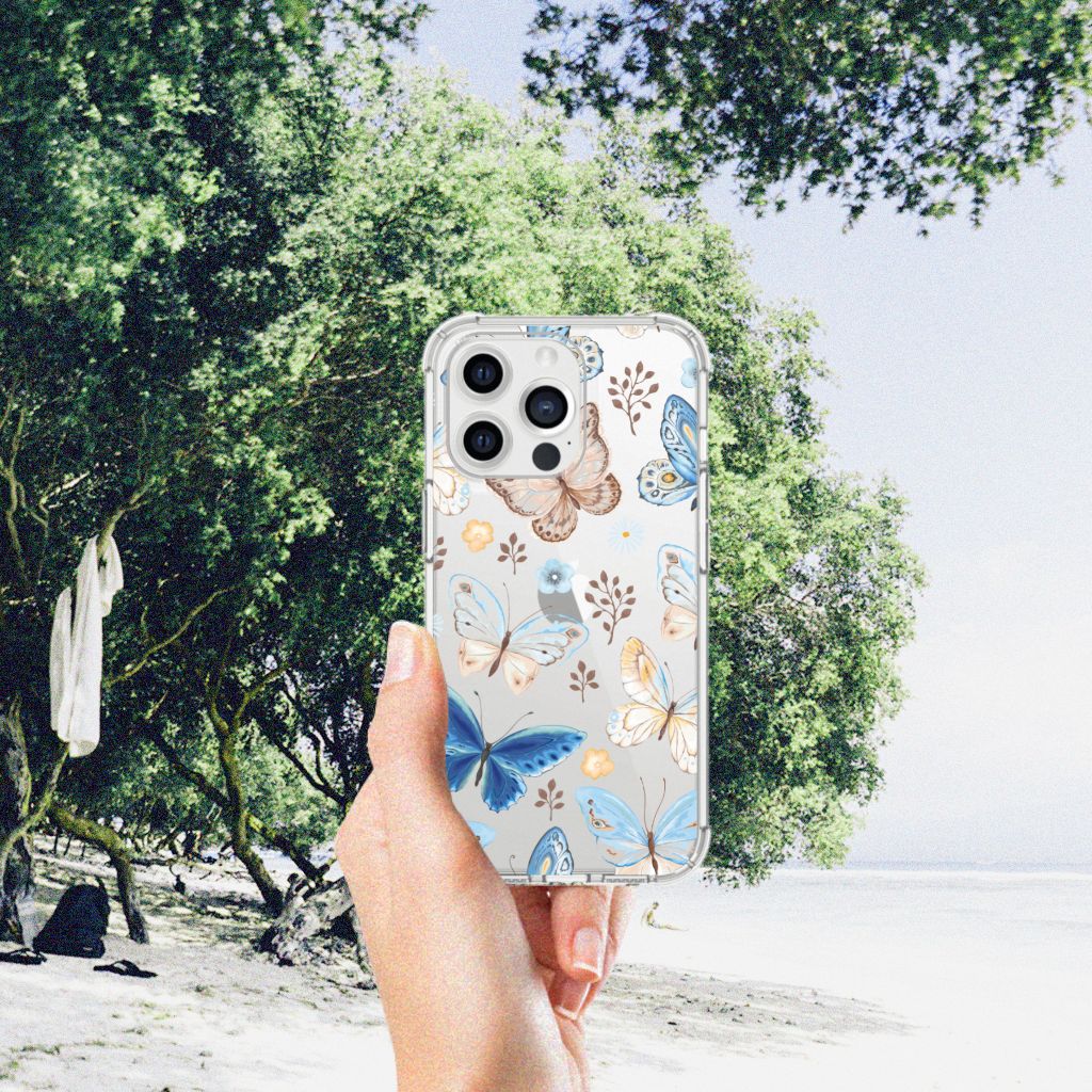 Case Anti-shock voor iPhone 13 Pro Max Vlinder met kleurrijk vlinderdesign in hand op strandachtergrond